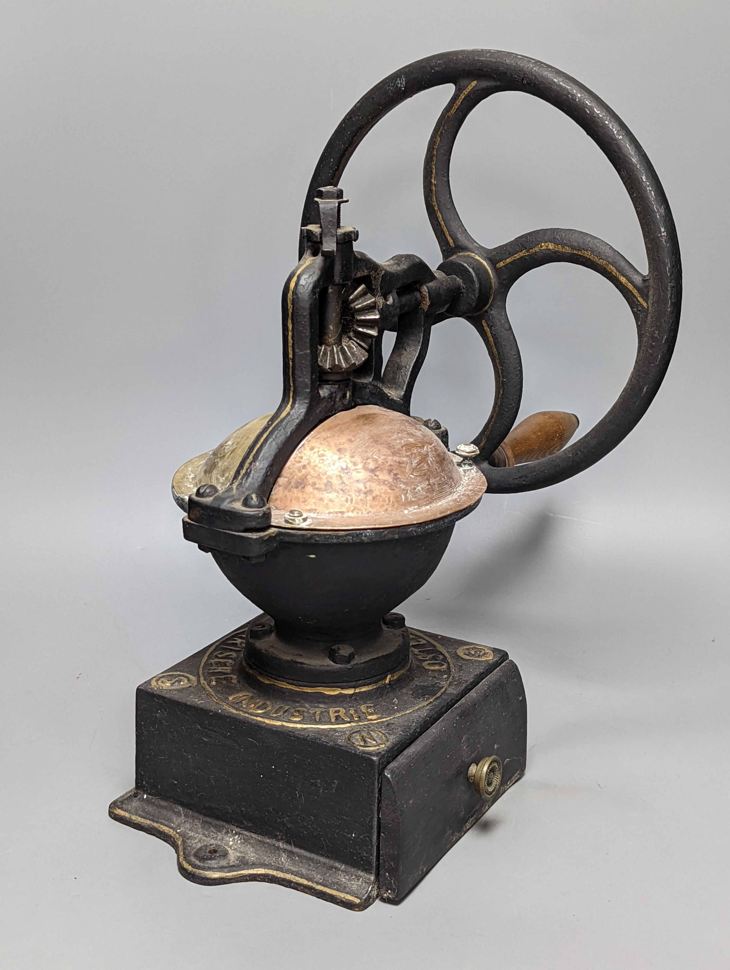 An Austrian cast iron and copper coffee grinder 45cm